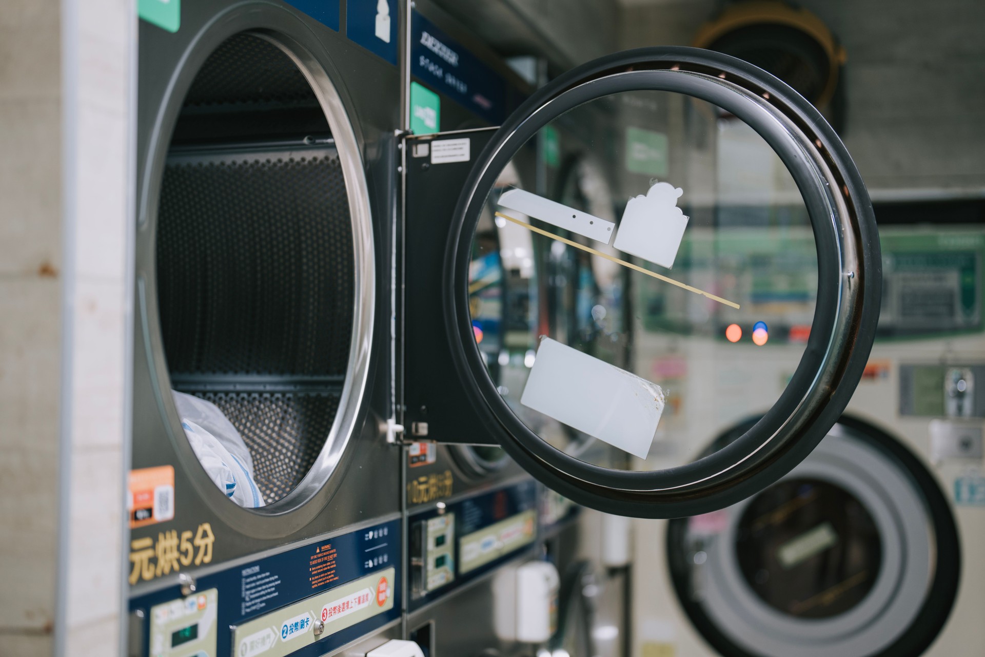 Washing machines - clothes washer’s door in a public launderette